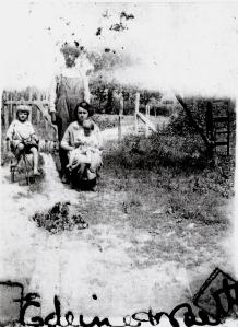 Earl and Ethel Mattox, holding their daughter Betty Lou.  Edeine Fielden on the tricycle.  Earl is a brother to Edeine's mother.